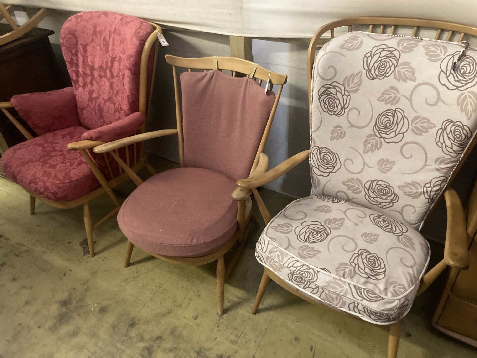 Three Ercol stickback beech open armchairs, largest width 72cm depth 80cm height 102cm